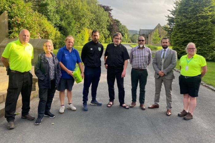 Burnley community unites to clean vandalised graves