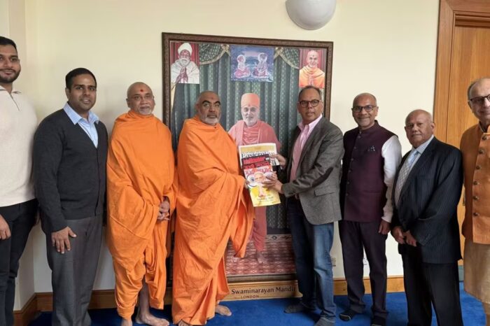 AMG team meets BAPS head priest during Hindu New Year celebrations