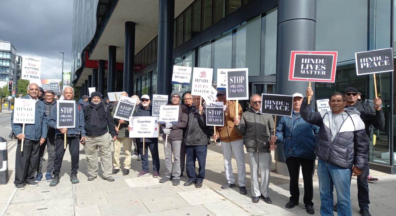 1 A British Hindu community members protest outside The Guardian’s headquarters