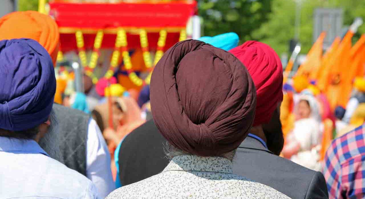 old sikh men with turbans on their head during a religious ceremony. Turban is an important religiuous symbol for the indian culture