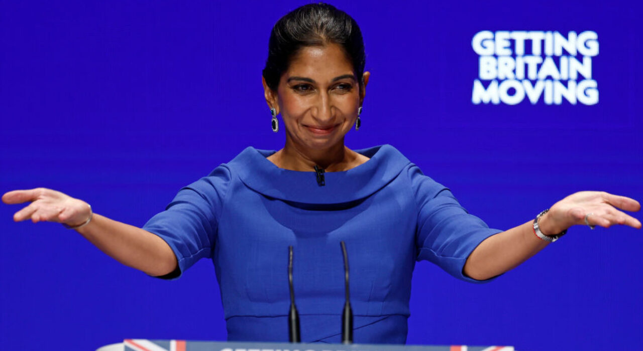 BIRMINGHAM, ENGLAND - OCTOBER 04: Suella Braverman, Secretary of State for the Home Department speaks on day three of the Conservative Party Conference on October 04, 2022 in Birmingham, England. This year the Conservative Party Conference will be looking at "Getting Britain Moving" with more jobs and higher salaries. However, delegates are arriving at the conference as the party lags 33 points behind Labour in the opinion polls. (Photo by Jeff J Mitchell/Getty Images)
