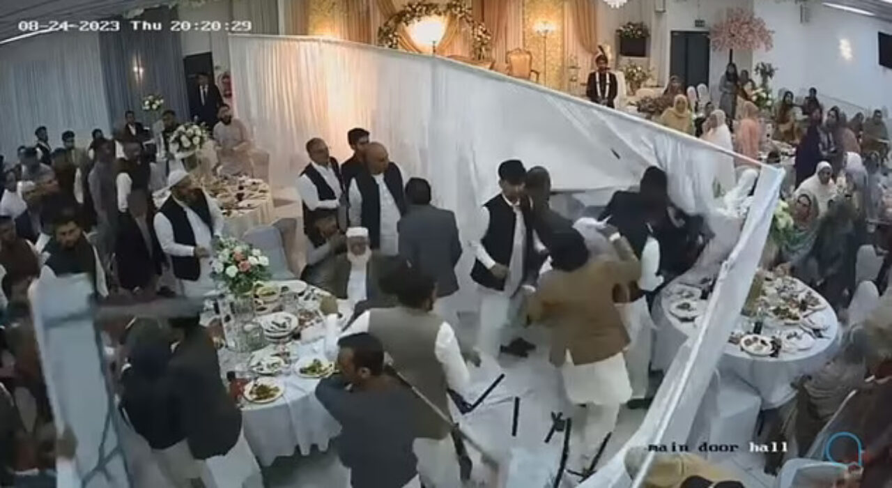 2 A Mass brawl suddenly erupts at a seemingly peaceful wedding reception in Bolton