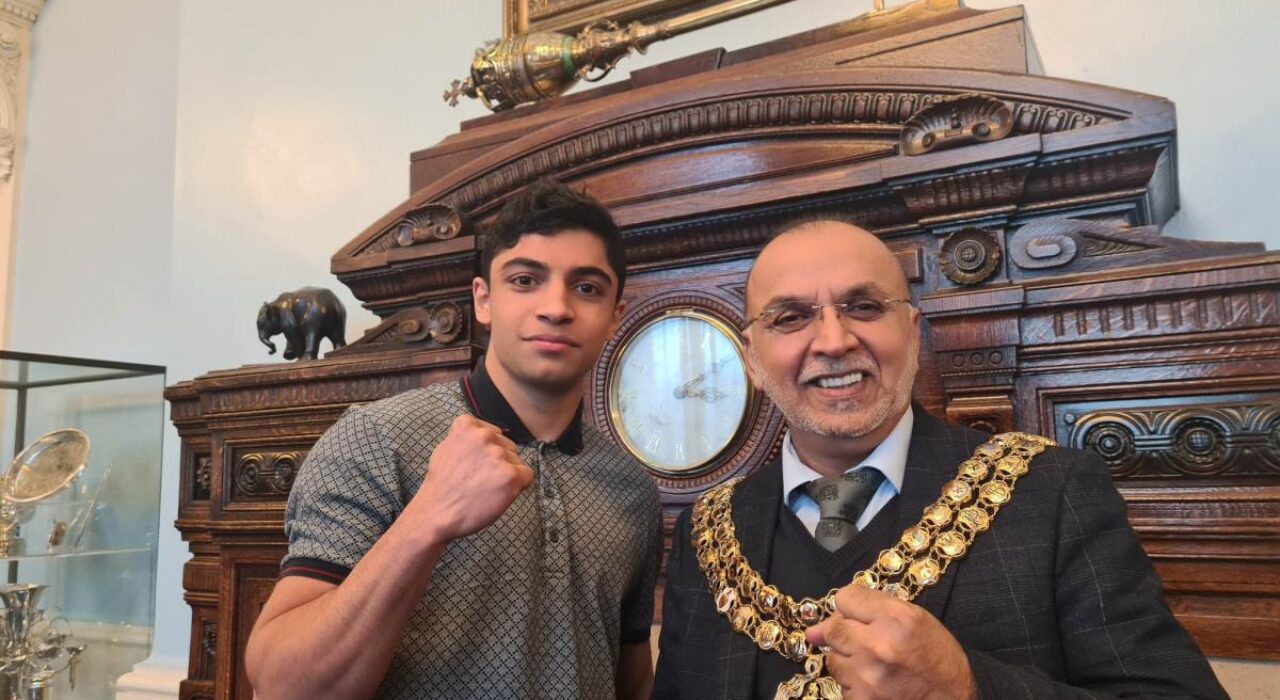 3 A Young professional boxing star, Abdul Khan, pays a visit to the mayor of Bolton
