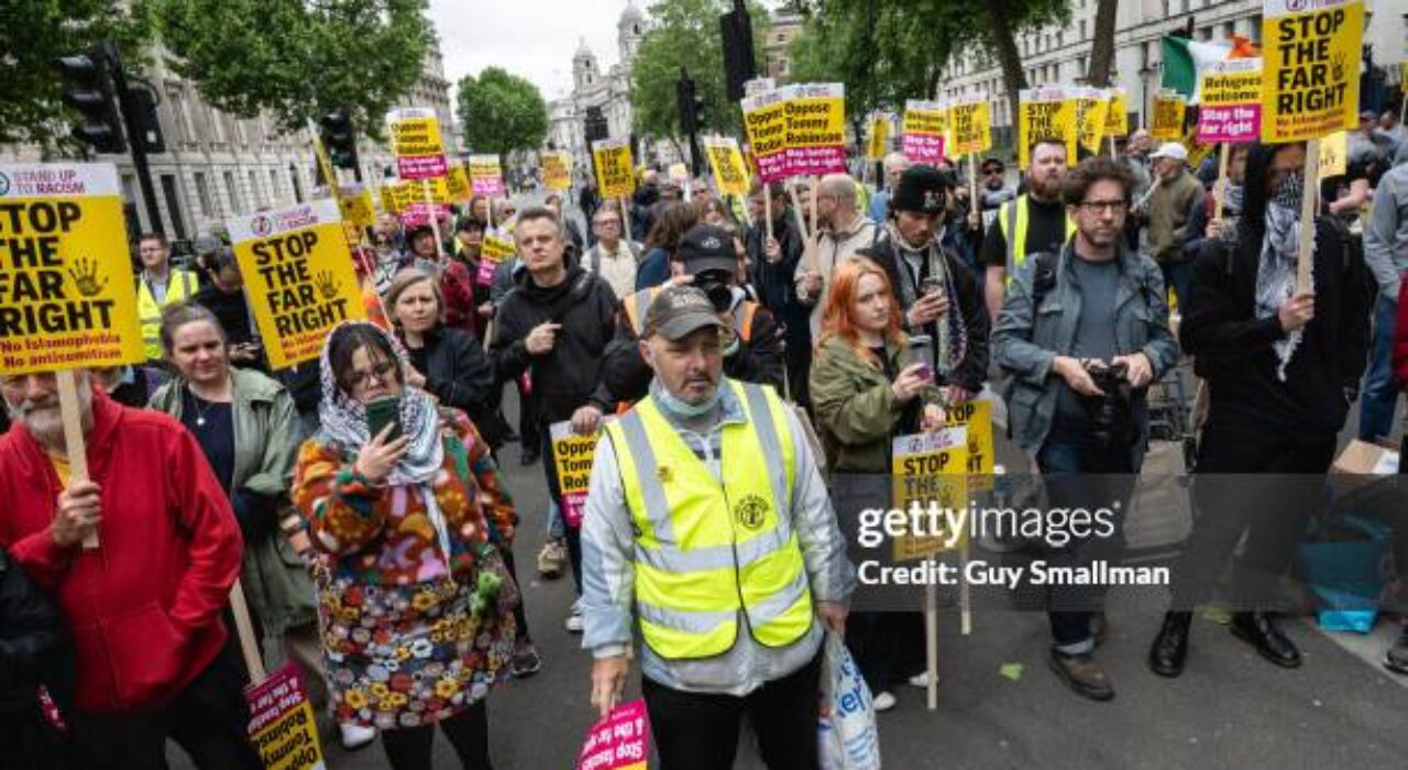 LONDON, ENGLAND - JUNE 1: Stand Up To Racism hold a counter protest in Whitehall on June 1, 2024 in London, England. Tommy Robinson, the founder of the right-wing group The English Defence League (EDL), called for his supporters to demonstrate against what he believes to be a two-tiered police and justice system. Stand Up For Racism (SUTR) and other anti-fascist groups staged a counter-protest. SUTR says, "Robinson is a fascist who has a history of involvement with fascist and far right organisations." (Photo by Guy Smallman/Getty Images)