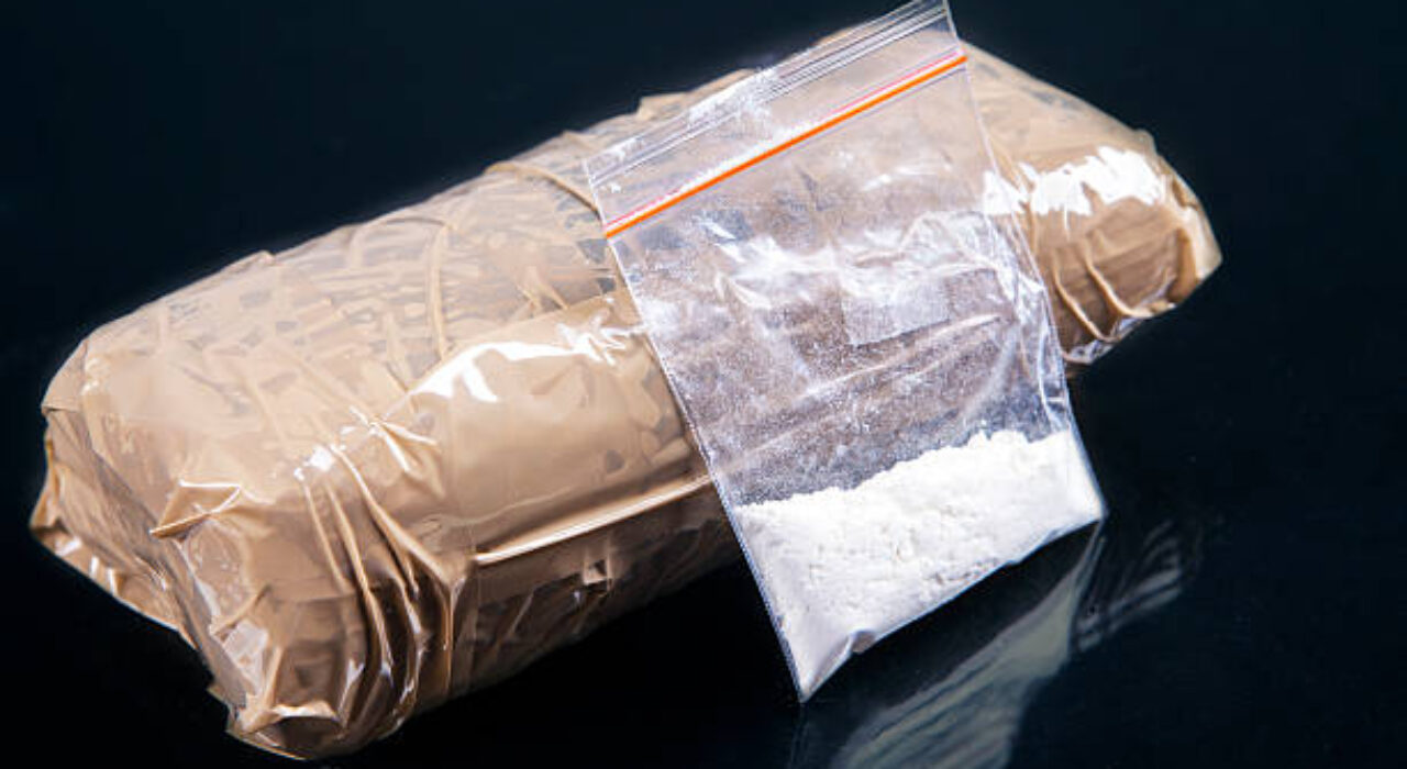 Cocaine powder in plastic bag with a packages