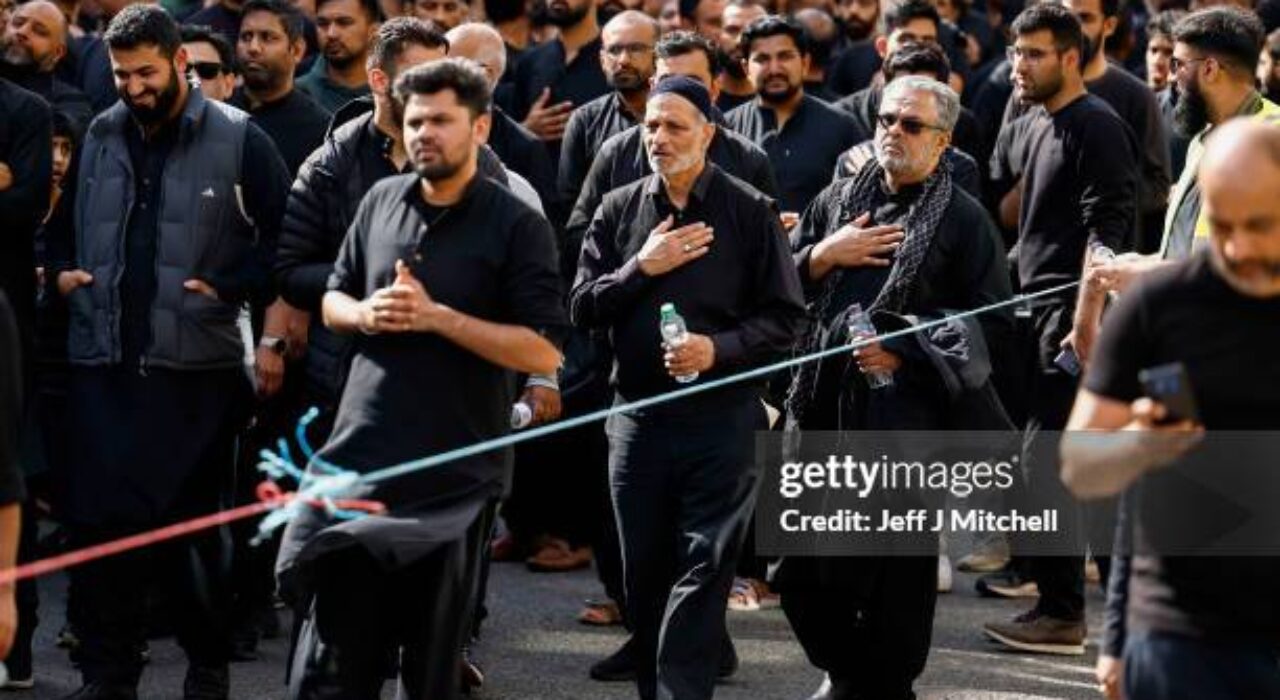 GLASGOW, SCOTLAND - AUGUST 09:  Muslim men chant during the Ashura festival procession through Glasgow on August 09, 2022 in Glasgow, Scotland. Ashura is a day of atonement for Shiite Muslims and commemorates the death of Husayn ibn Ali, a grandson of the prophet Muhammad. The procession was organised by the Shia Asna Ashri Islamic Centre of Glasgow. (Photo by Jeff J Mitchell/Getty Images)